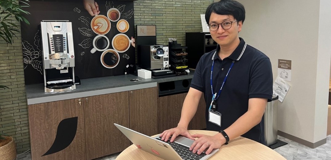 Kakeru working on his laptop