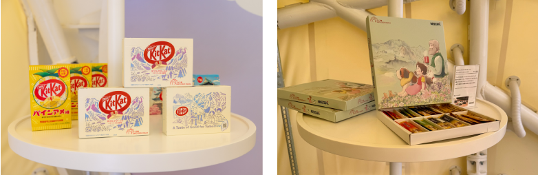 左）美しい切り絵のパッケージで、スイスと日本のクラフトマンシップを表現した「キットカット ダブルクリーム ラズベリー添え風味」、右）「アルプスの少女ハイジ」オリジナルデザインが描かれた箱に入った、「ネスカフェ ゴールドブレンド」スティックギフトセット