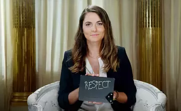 Woman holding the "Respect" card